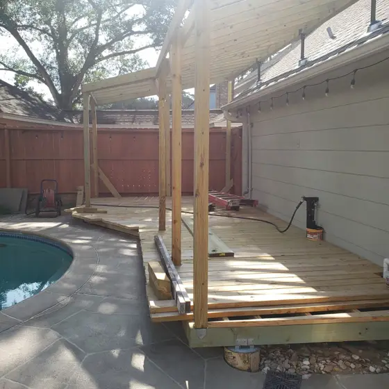 Poolside deck and outdoor structure — photo P228