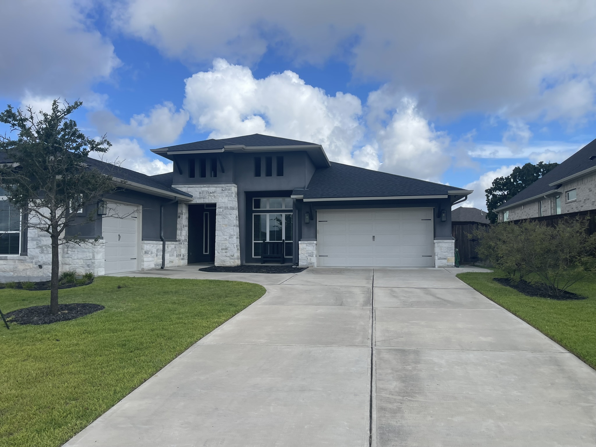 Clean finished residential driveway after pressure washing